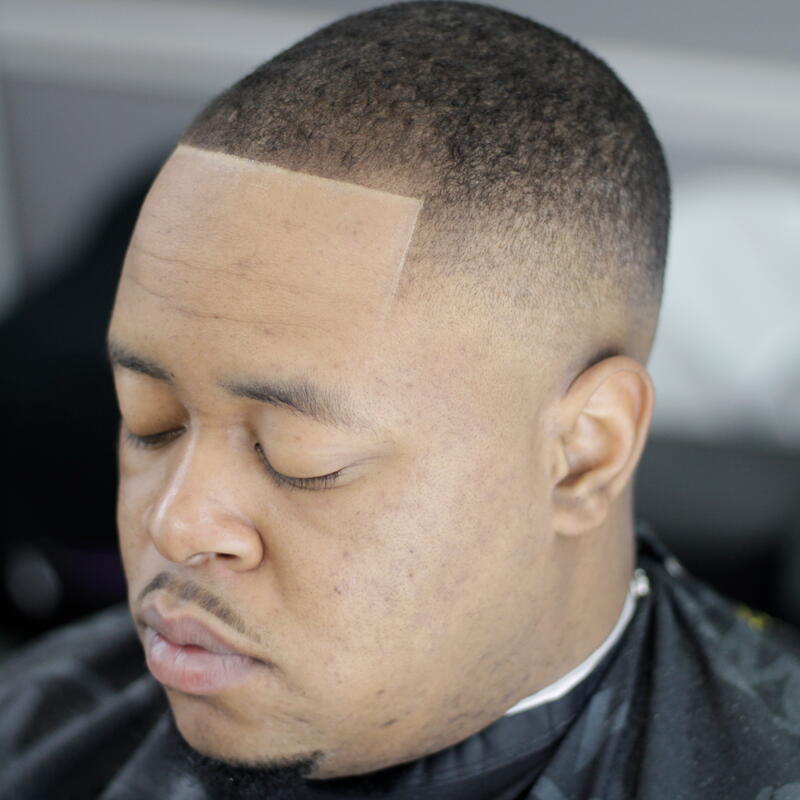 Clean buzz with skin fade by Mac, Nashville barber